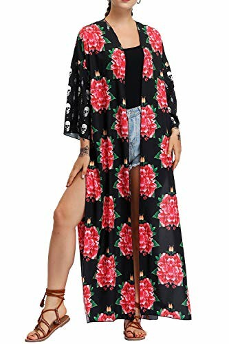 Woman wearing a floral kimono cardigan with red flowers.