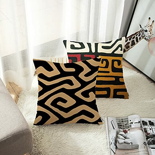 Abstract pattern pillows on a couch with a giraffe artwork in the background.