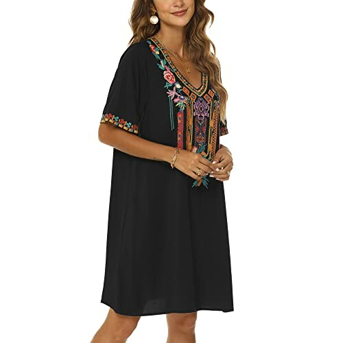 Woman wearing a black dress with colorful embroidery