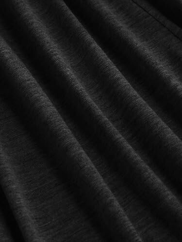 Close-up of black fabric texture with folds