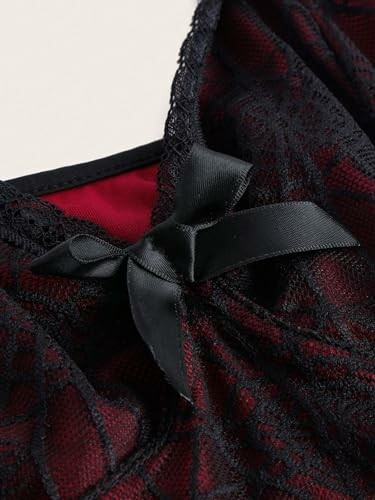 Close-up of black lace fabric with bow detail