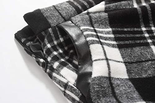 Close-up of black and white plaid fabric with leather trim.