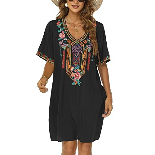 Woman wearing black dress with colorful embroidery and hat