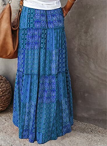 Woman wearing a blue patterned bohemian maxi skirt.