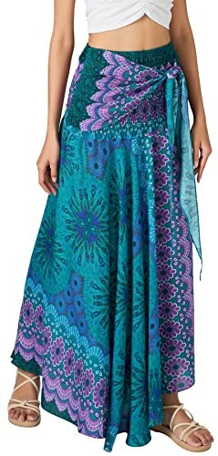 Woman wearing a colorful bohemian maxi skirt with a tie-front design.