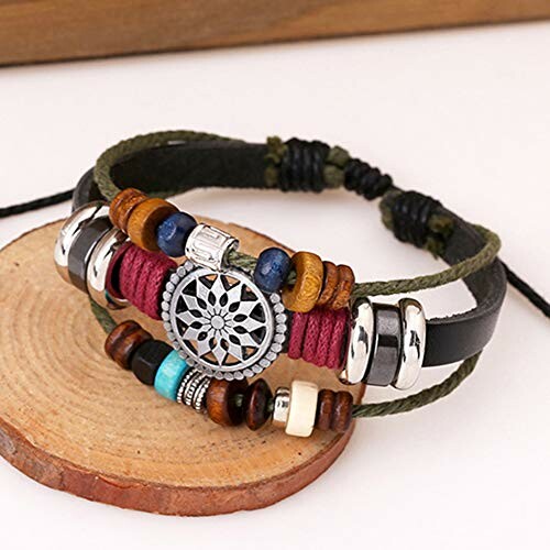 Bohemian multilayer leather bracelet with beads and metal charm.