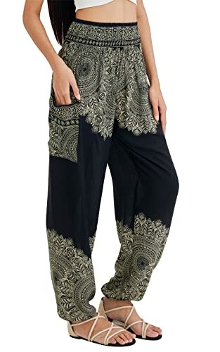 Woman wearing bohemian style wide-leg pants with intricate patterns.