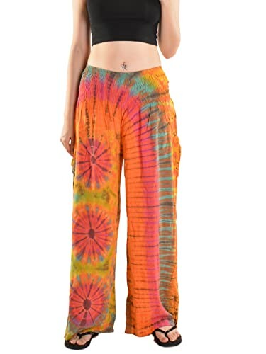 Person wearing colorful tie-dye pants and a black top.