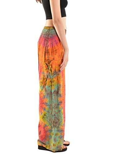 Person wearing colorful tie-dye pants and a black top.