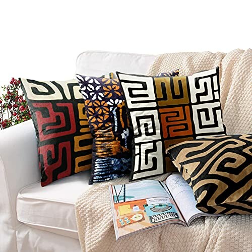 Couch with colorful tribal pattern pillows and an open magazine.