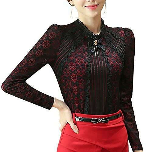 Woman wearing a black lace blouse with red skirt.