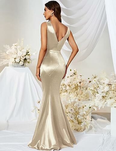 Woman in elegant gold evening gown with floral background