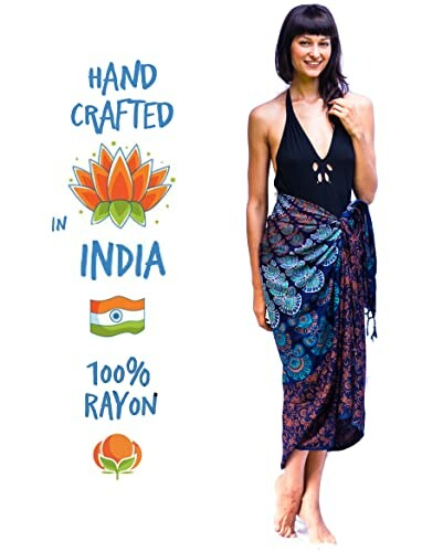 Woman wearing a black swimsuit and patterned sarong with text 'Hand Crafted in India 100% Rayon'.