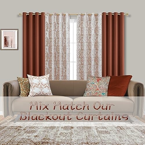 Living room with patterned and solid curtains behind a sofa with patterned pillows.