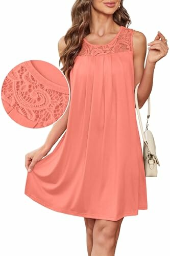 Woman wearing sleeveless coral dress with lace detail.