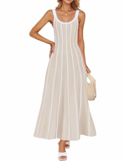 Woman wearing a beige sleeveless striped maxi dress.
