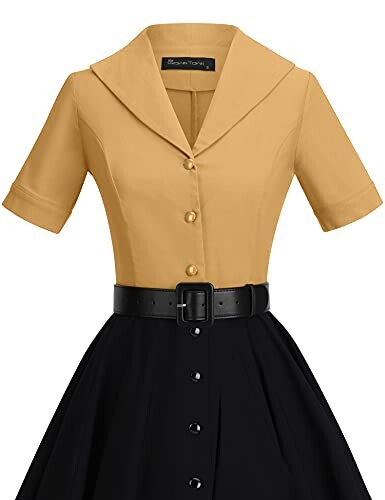 Vintage style yellow blouse with black skirt and belt.