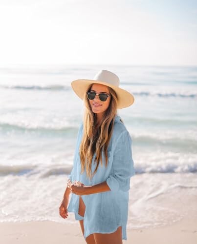 Woman in sunhat and sunglasses at the beach