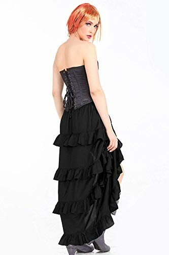 Woman in black dress with ruffles, back view