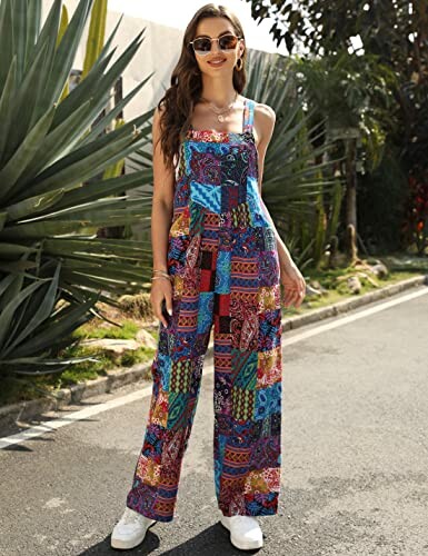 Woman wearing a colorful patterned jumpsuit standing on a street