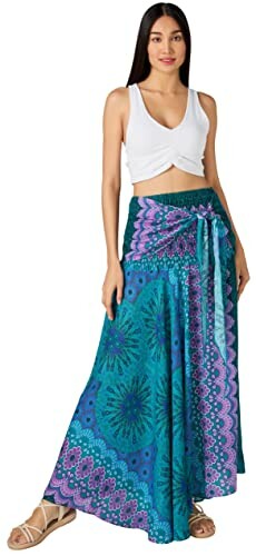 Woman in white top and colorful maxi skirt.