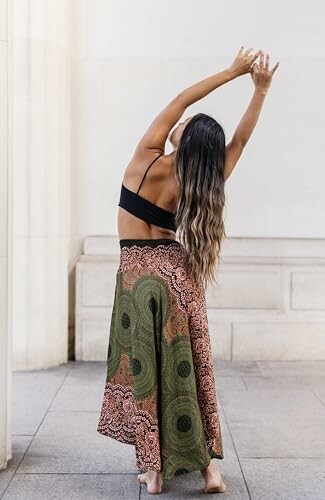 Woman stretching in a yoga pose indoors.