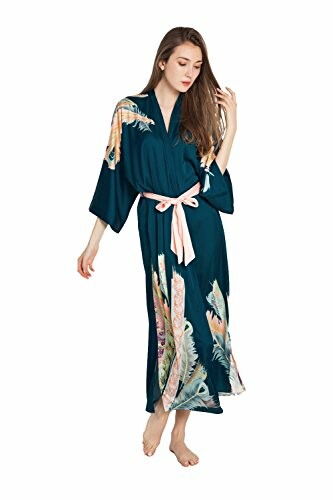 Woman wearing a teal silk kimono with floral patterns.