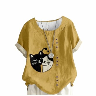Yellow shirt with black and white yin-yang cat design and buttons.